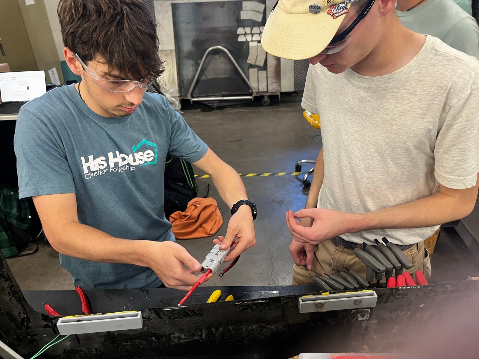 Andrew and Luke working with the battery connector.